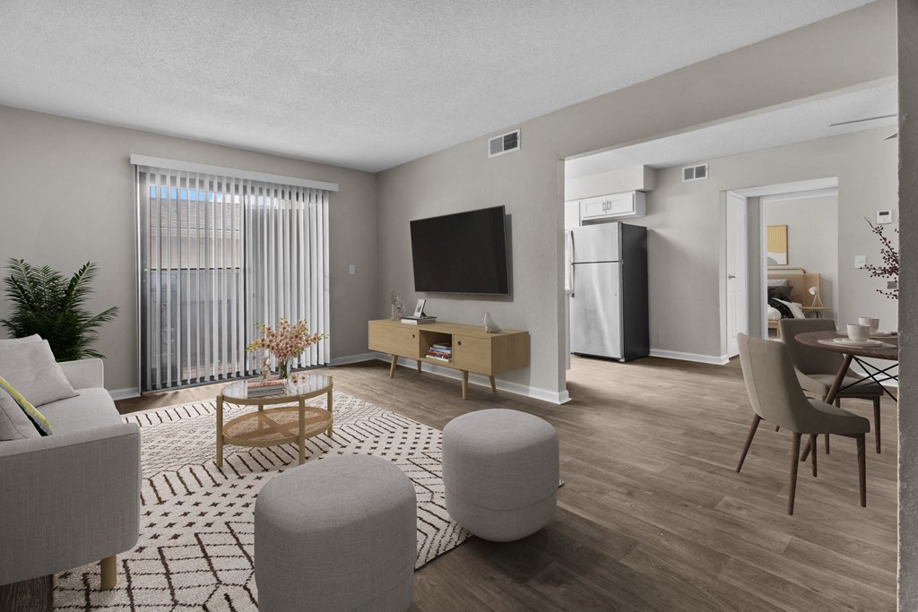 the living room of an apartment with a couch and a table