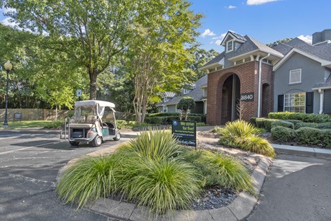 a golf cart parked in front of a house