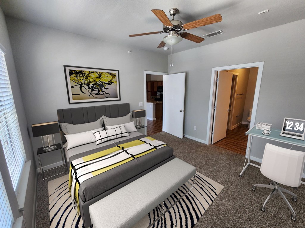 a bedroom with a bed and a ceiling fan