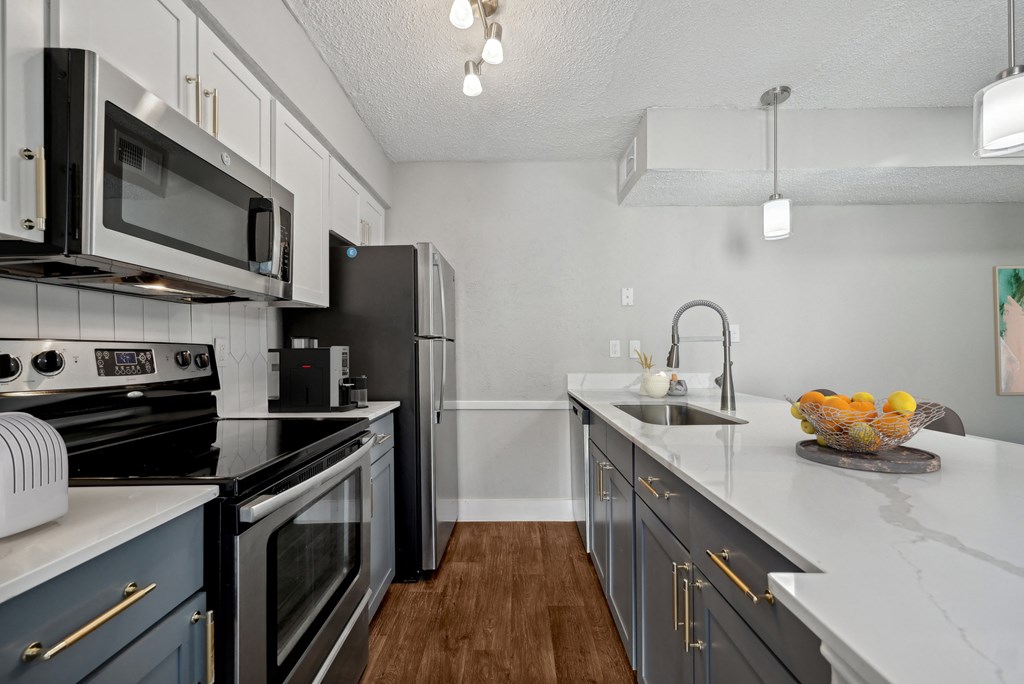 the preserve at ballantyne commons apartment kitchen with stainless steel appliances