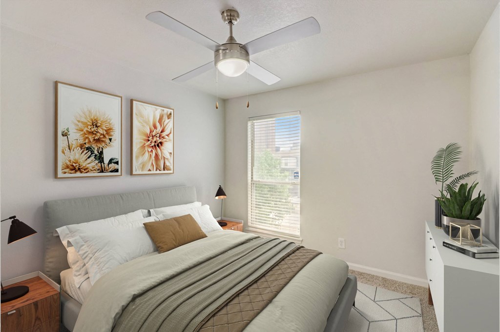 a bedroom with a bed and a ceiling fan