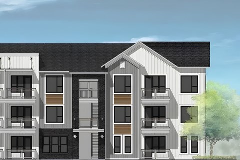 A modern apartment building with balconies and a mix of window designs.