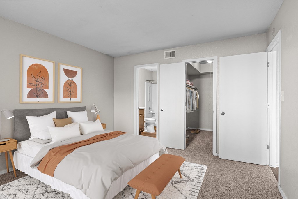 a bedroom with a large bed and a closet