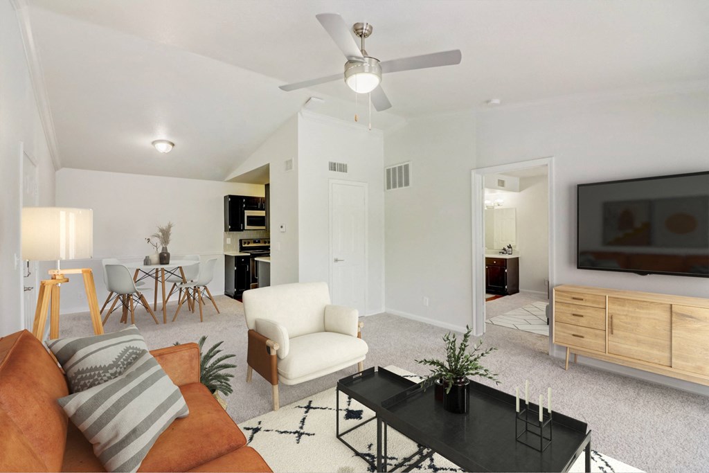 a living room with a couch and a table and a tv