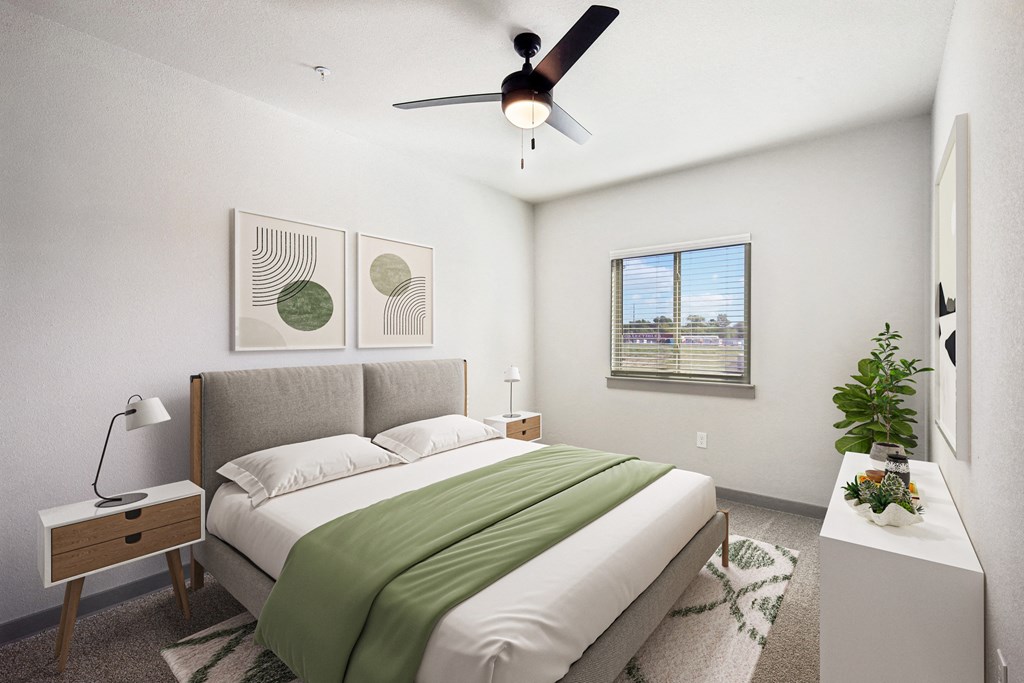 an image of a bedroom with a bed and a ceiling fan