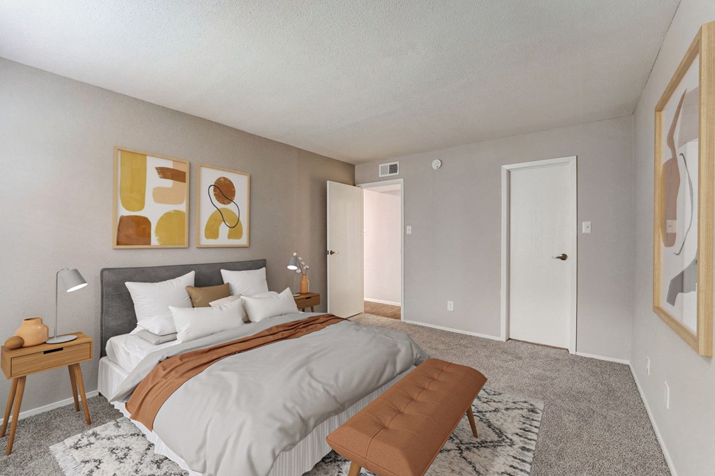 a bedroom with a large bed and a closet