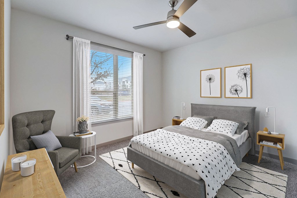a bedroom with a bed and a ceiling fan