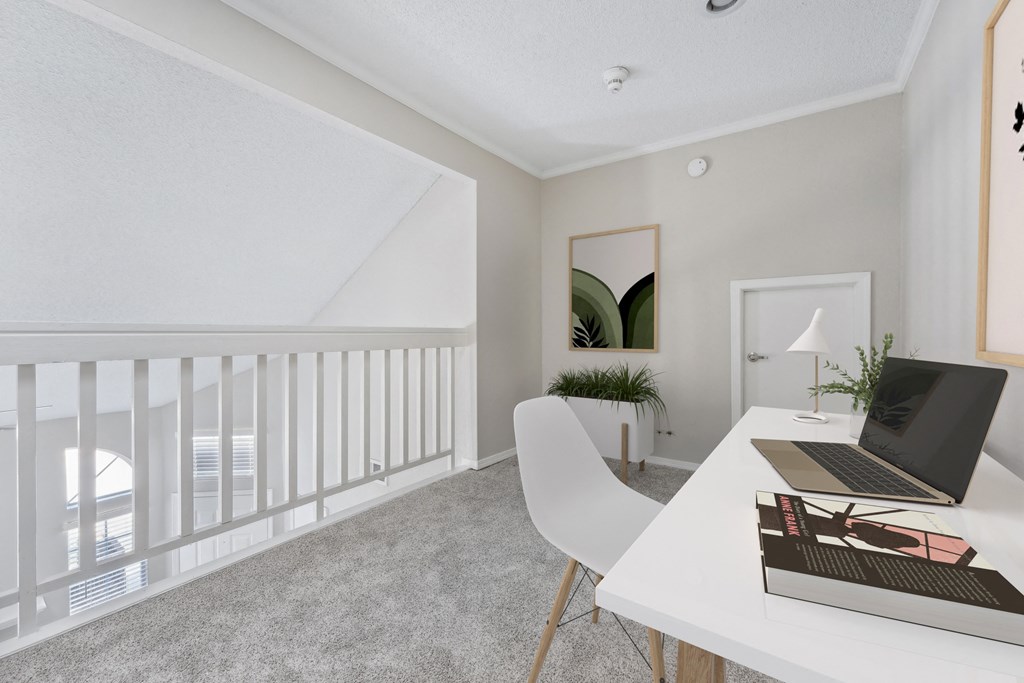 a home office with a white desk and a laptop on a desk
