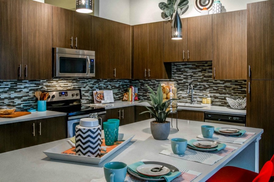 a kitchen and dining area with a table and chairs