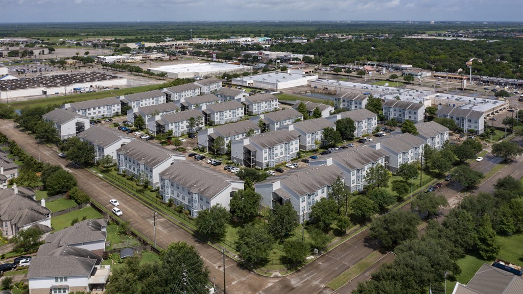 an aerial view of an apartment complex in the suburbs