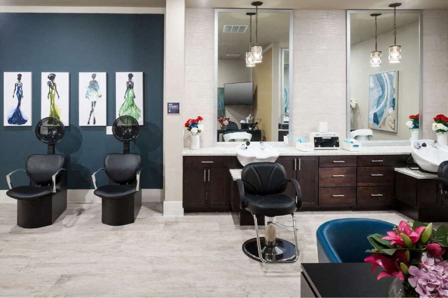 a room with a table and chairs and a mirror