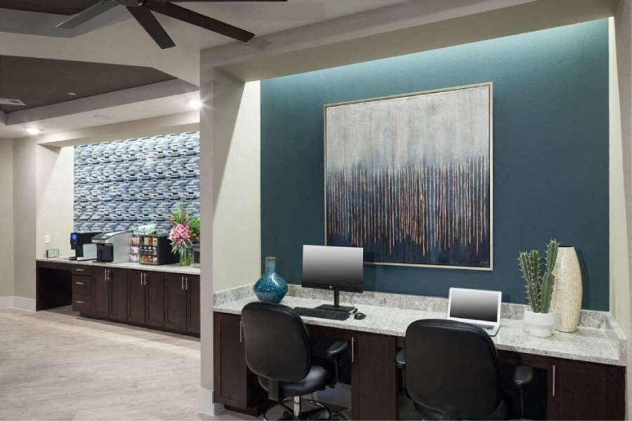 a large office with two desks and two computers