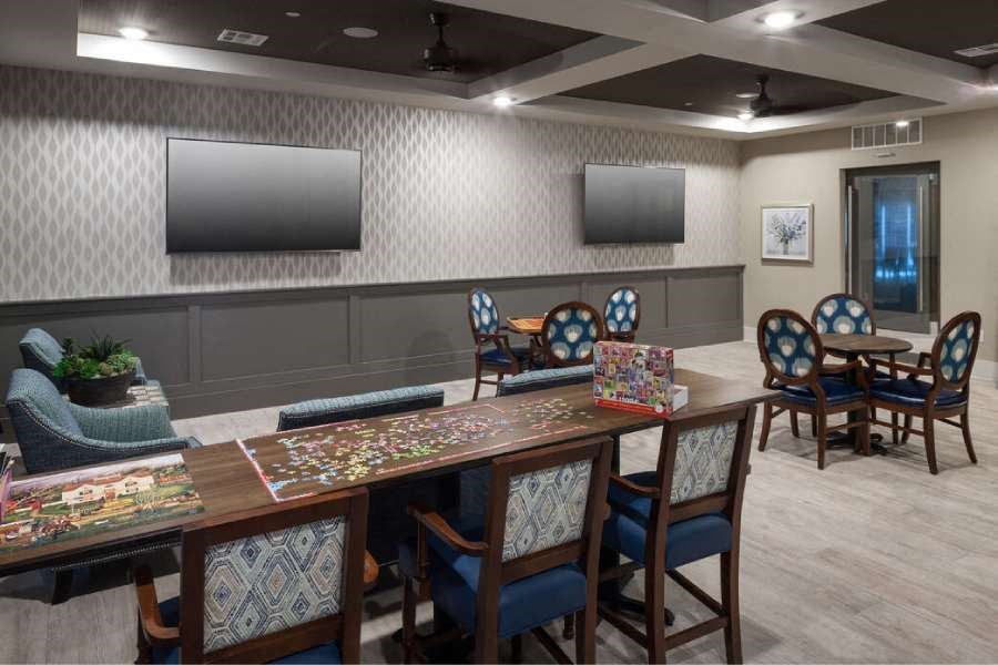 a dining room with a table and chairs
