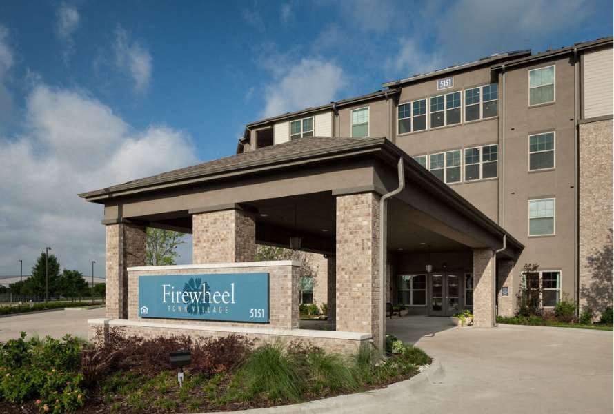 a large building with a sign in front of it