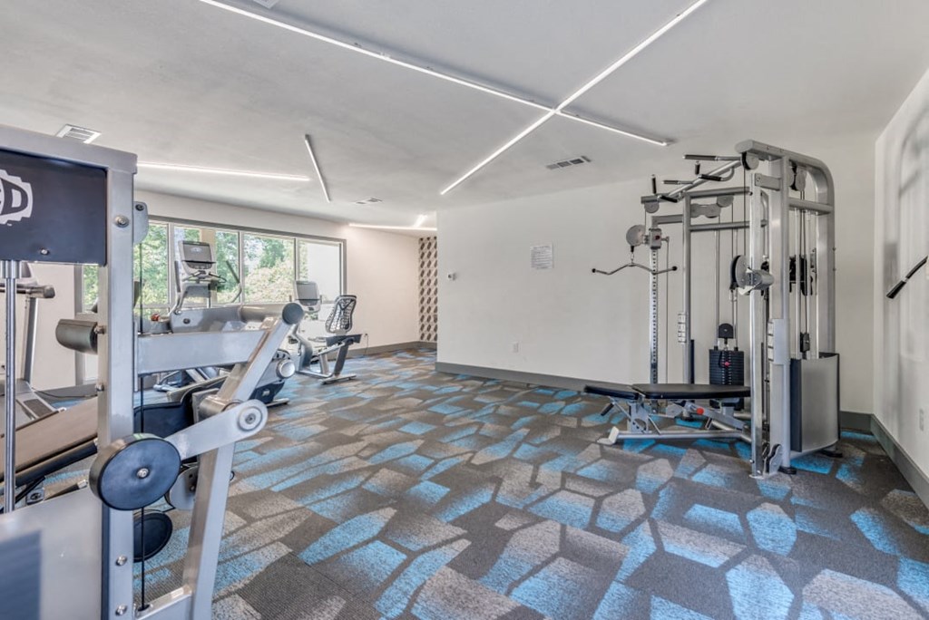 a gym with weights and equipment in a home for sale
