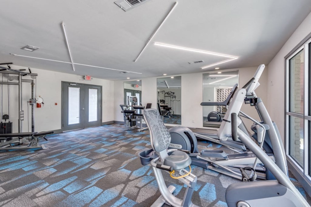 the gym at the preserve at polo ridge apartments in