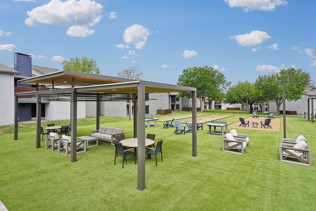 a rendering of a picnic area with tables and chairs on the grass