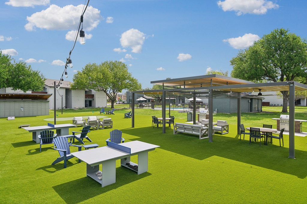 a rendering of a park with tables and chairs and a pavilion