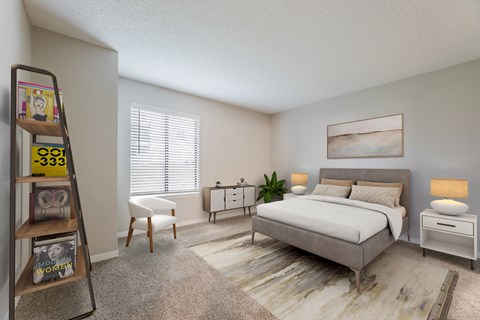 Carpeted bedroom with wide window, framed artwork, and room for a dresser and seating.