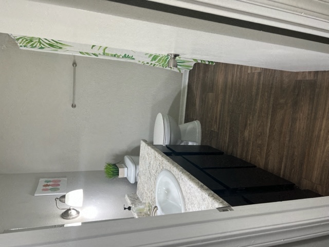 a bathroom with a mirror and a toilet in it