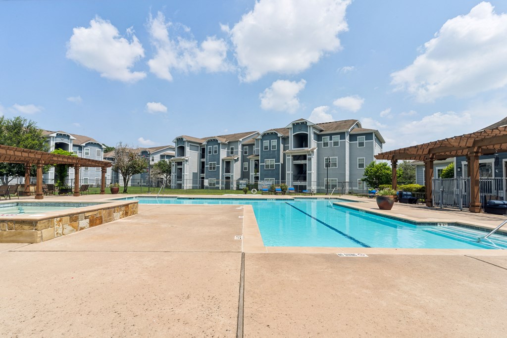 the preserve at ballantyne commons swimming pool with apartment buildings in the background