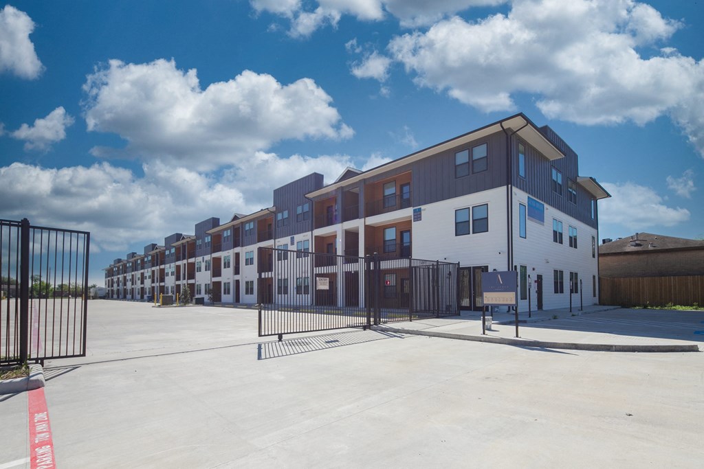 a row of new apartment buildings on a sunny day