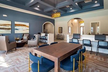 a large dining room with a table and chairs