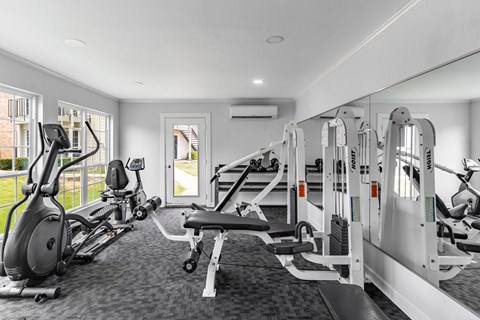 Fitness center with cardio and weight equipment at Creek on Calloway Apartments, Texas
