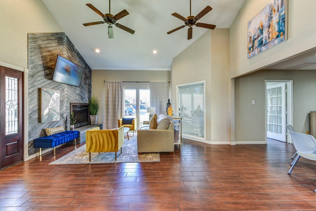 a living room with a couch and a chair and a fireplace