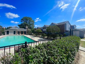 take a dip in the pool at villas at houston levee west apartments in cord  at Marymont, Texas