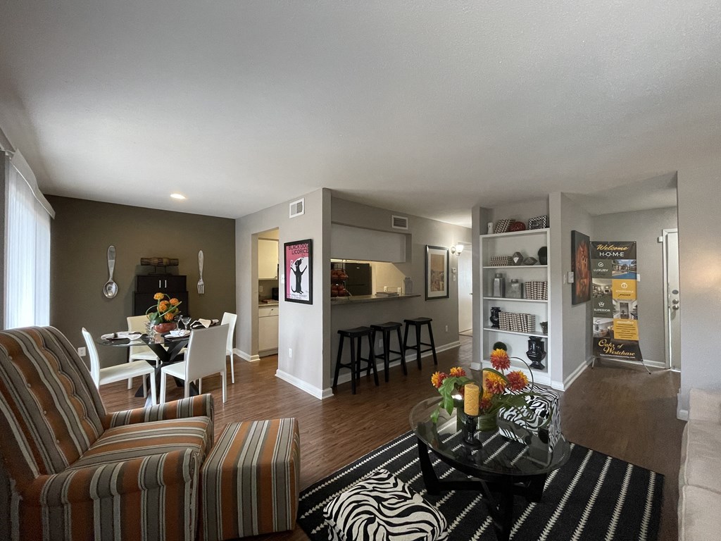 a living room with a couch and a table at Oaks of Westchase, Houston, Texas