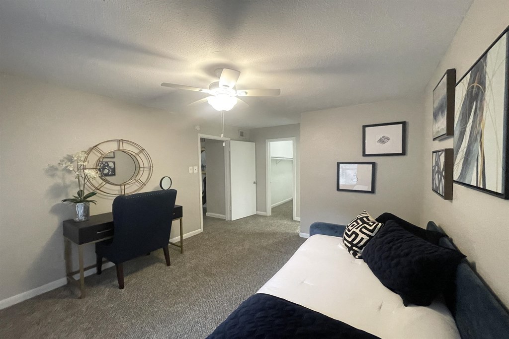 our apartments offer a bedroom with a bed and a desk