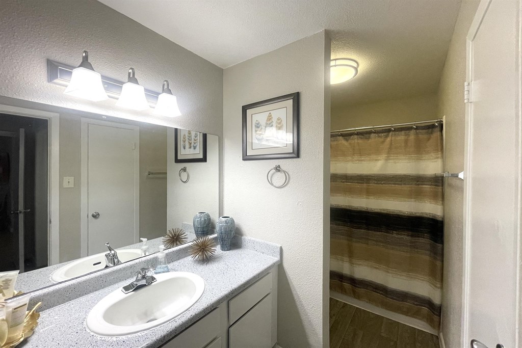 an image of a bathroom with a sink and a shower