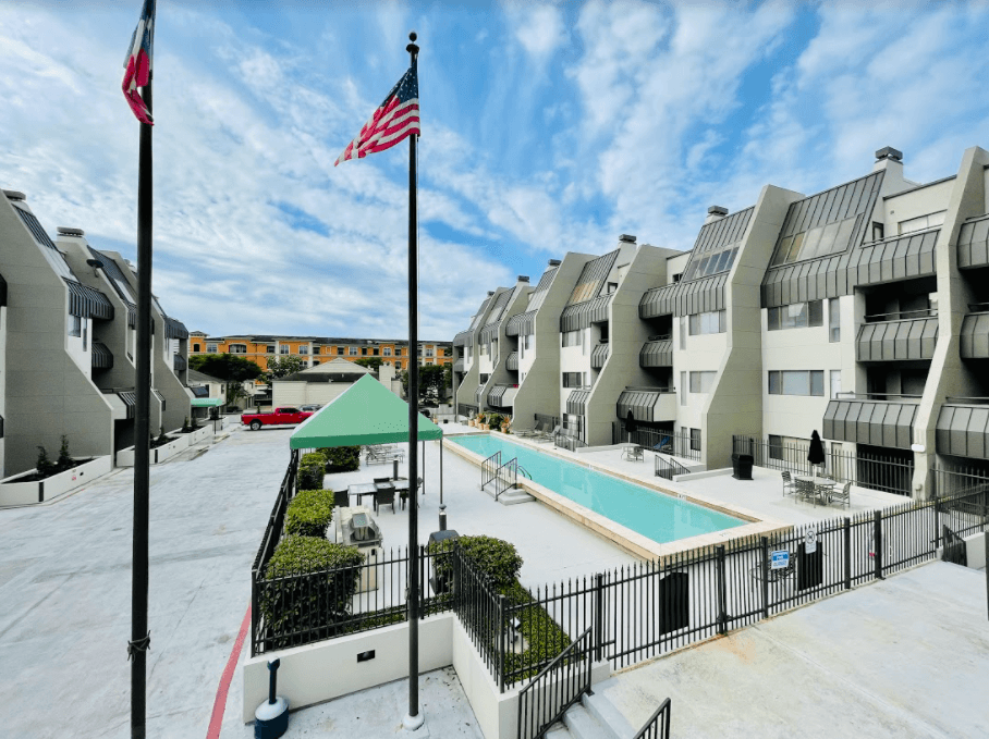 Exterior with flag at Augusta Court Apartments, Houston, 77057