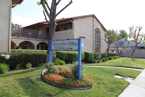 A sign for Arrowcrest Olive reads "1400 S. Orange Ave, Garden Grove.".