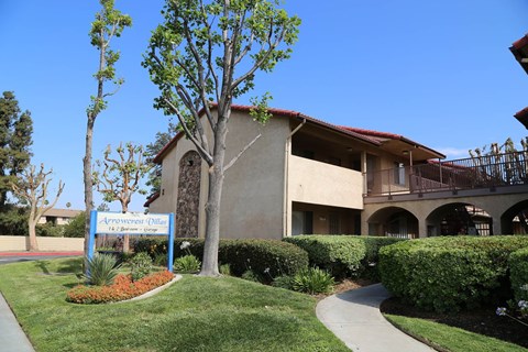 A building with a sign that says "Academy of Woodland".