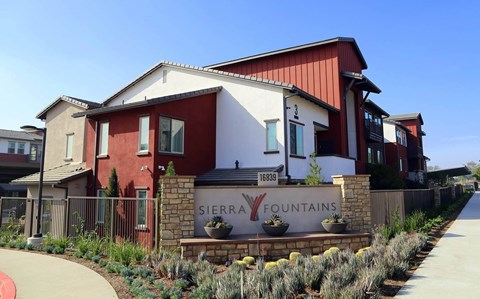 A red and white building with a sign that says Sierra Fountains.