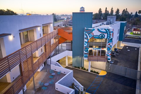A building with a blue and white mural on the side.