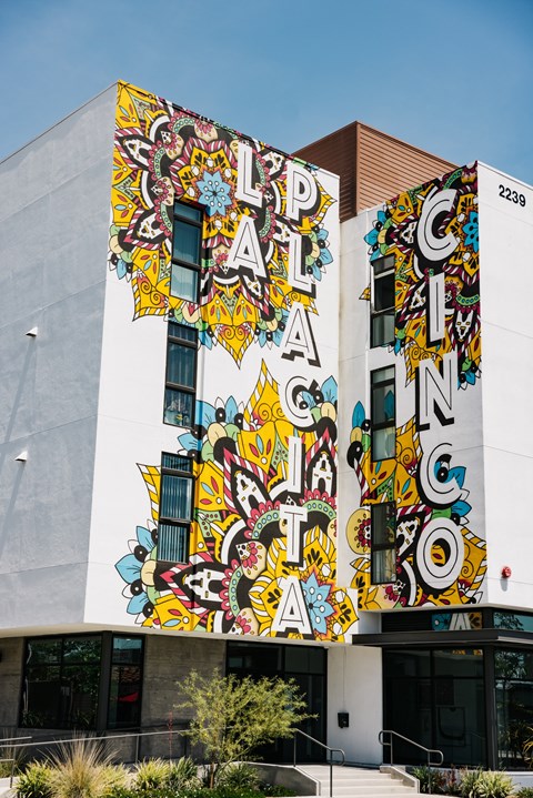A building with a mural on the side of it.