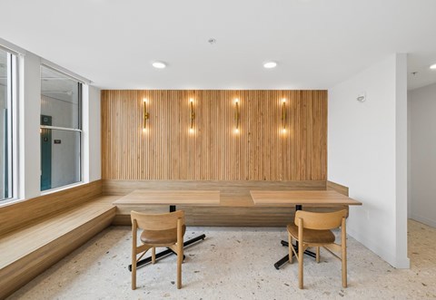 A conference room with a long table and chairs.