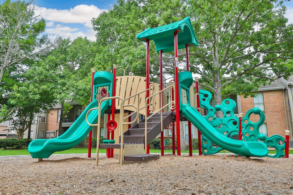 a playground with a slide and a staircase
