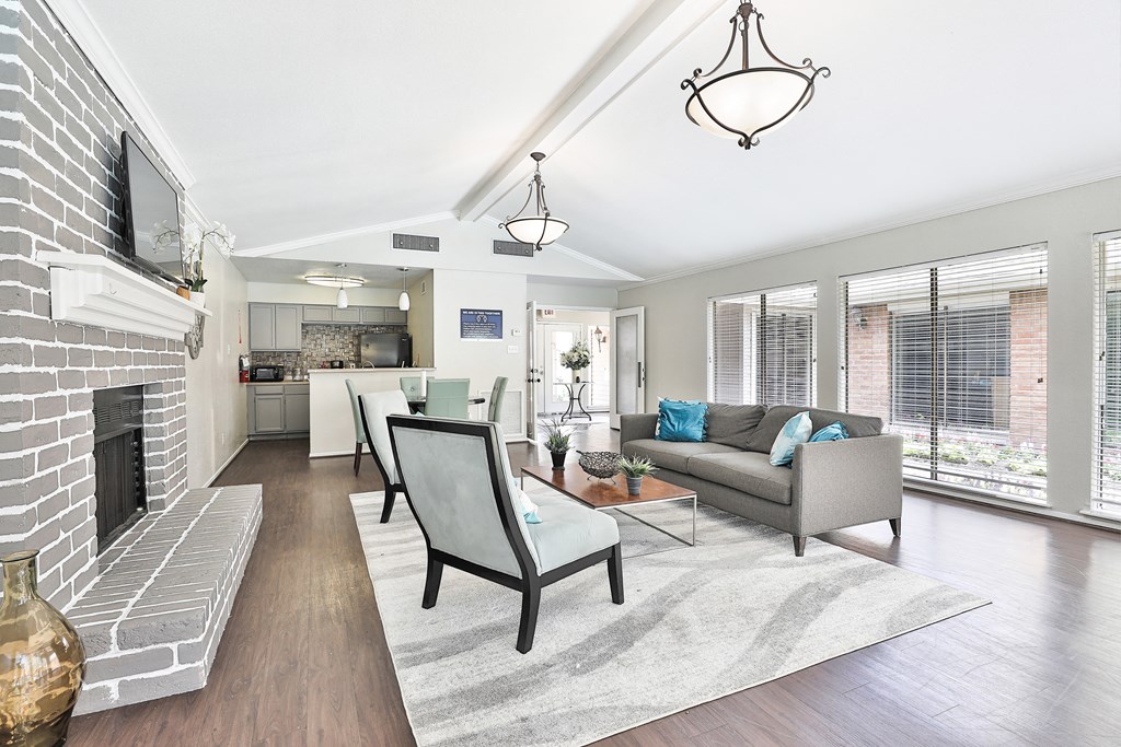 a living room with a fireplace and a rug
