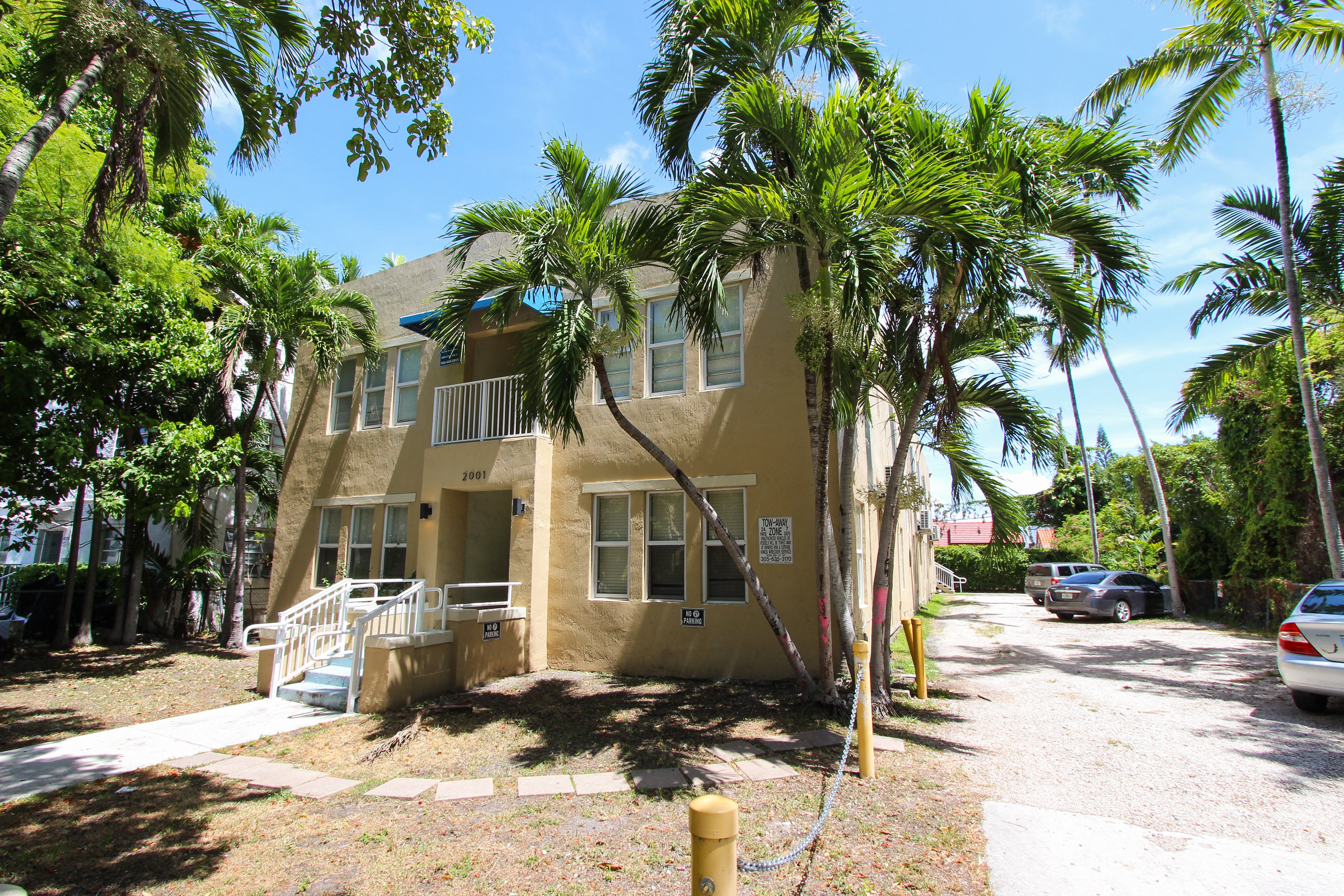 a house with a palm tree in front of it