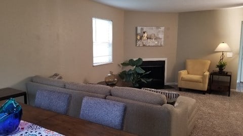 a living room with a couch and a chair