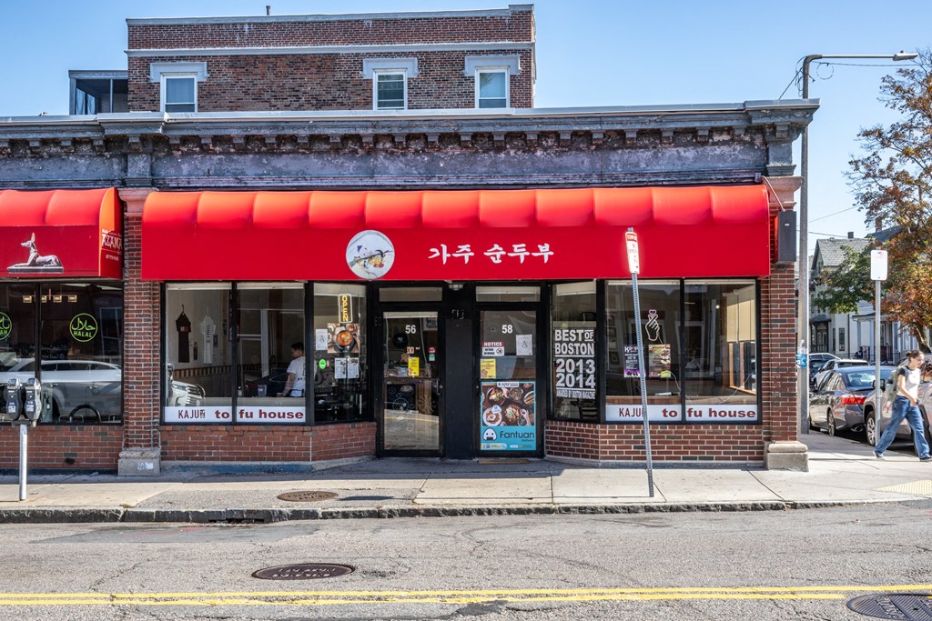 the front of a restaurant with a red facade on a city street at The Indie, Boston, 02134  