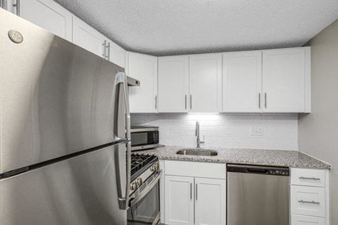 Renovated Kitchen with Granite Countertops & Stainless Steel Appliances