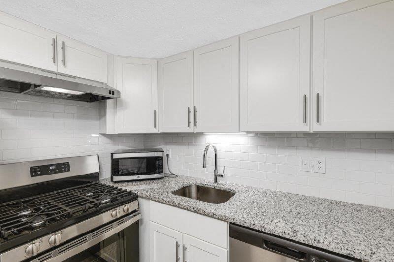 Renovated Kitchen with Granite Countertops & Stainless Steel Appliances