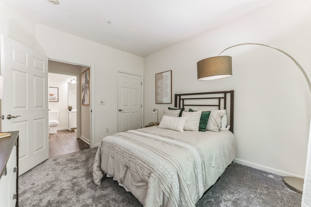 a bedroom with a large bed and a closet  at Cumberland Crossing, Cumberland, 02864