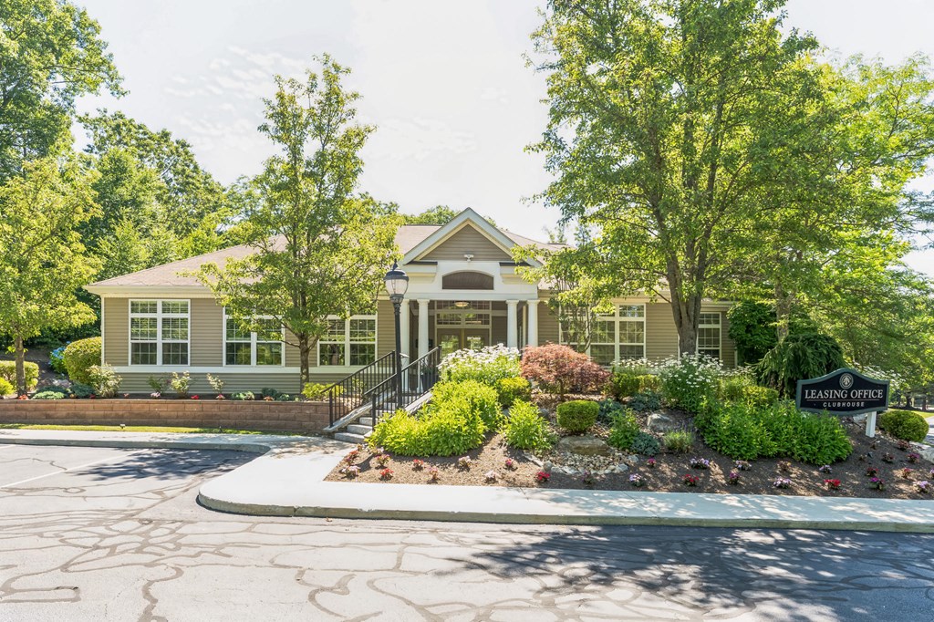 the front of a house with a driveway and trees  at Cumberland Crossing, Cumberland, 02864