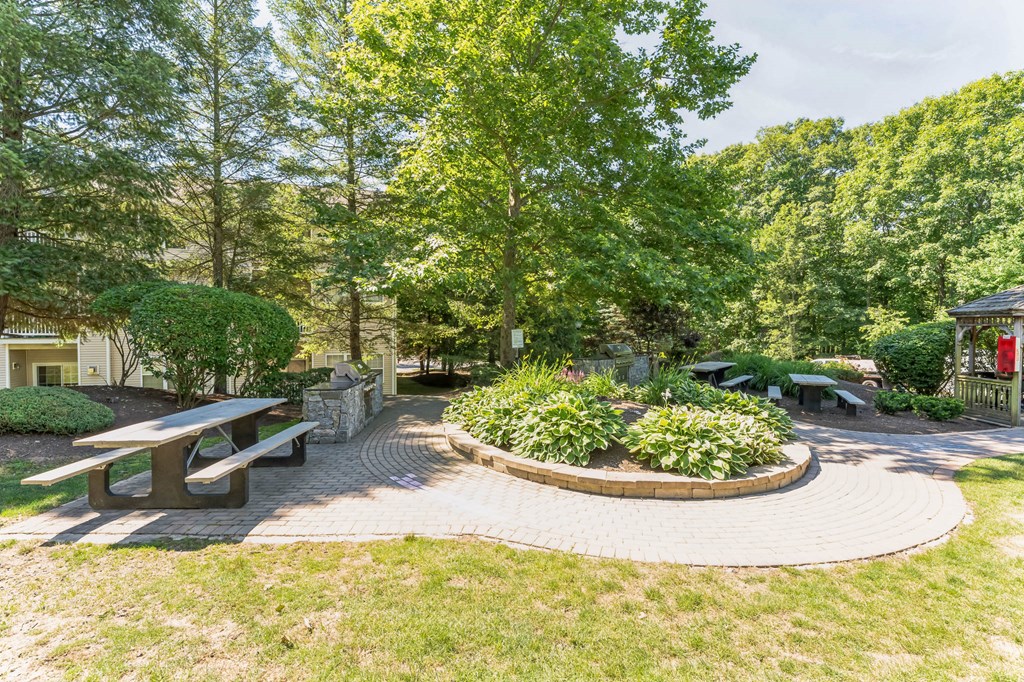a row of chairs sitting in front of a field of trees  at Cumberland Crossing, Cumberland, 02864